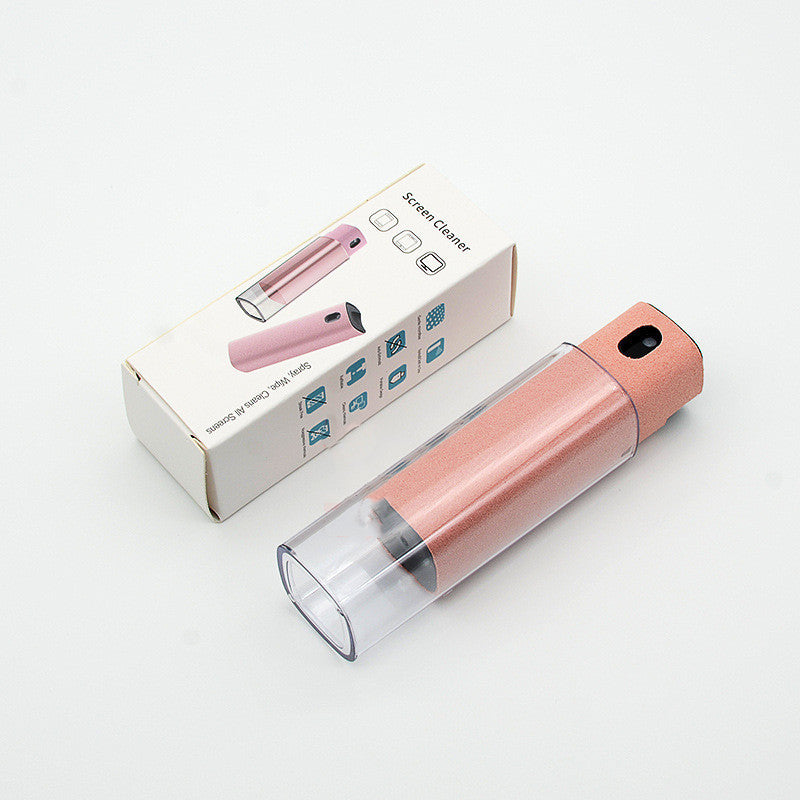 Compact screen cleaner with storage in pink with clear cap alongside its packaging box