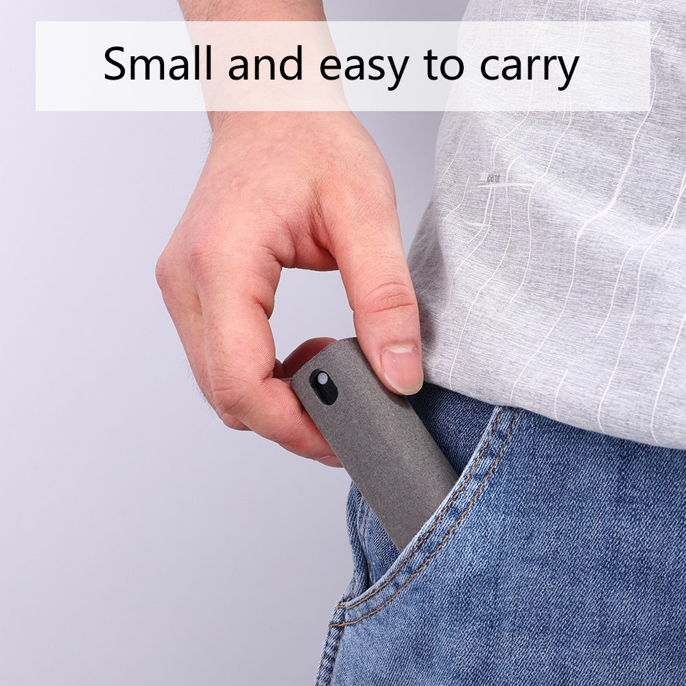 Hand placing compact screen cleaner with storage into blue jeans pocket for easy carrying