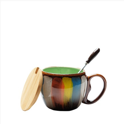 Shopi Vella creative ceramic coffee mug with colorful exterior, green interior, wooden lid, and spoon