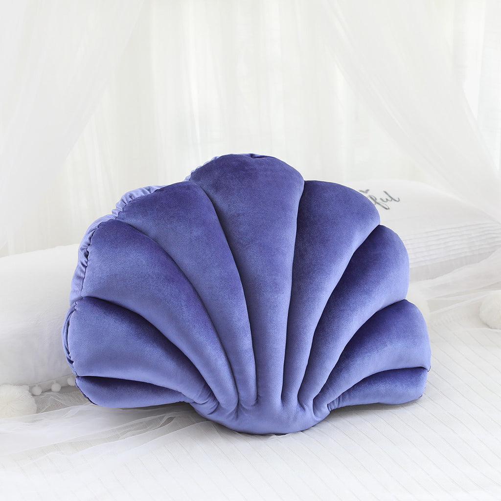 Shopi Vella cute shell nap pillow for kids in soft purple velvet fabric on white bed