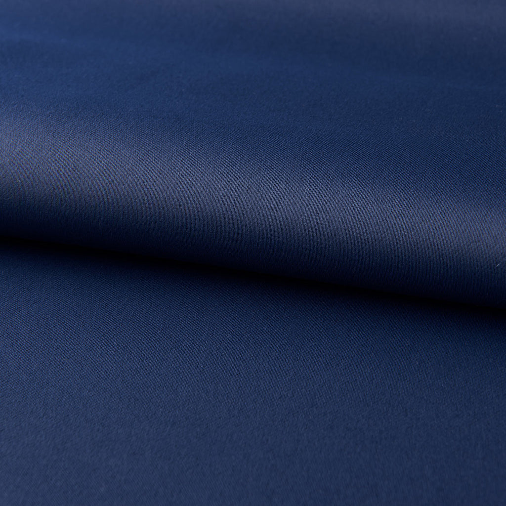 Close-up of dark blue blackout curtains fabric texture from Shopi Vella for light-blocking comfort