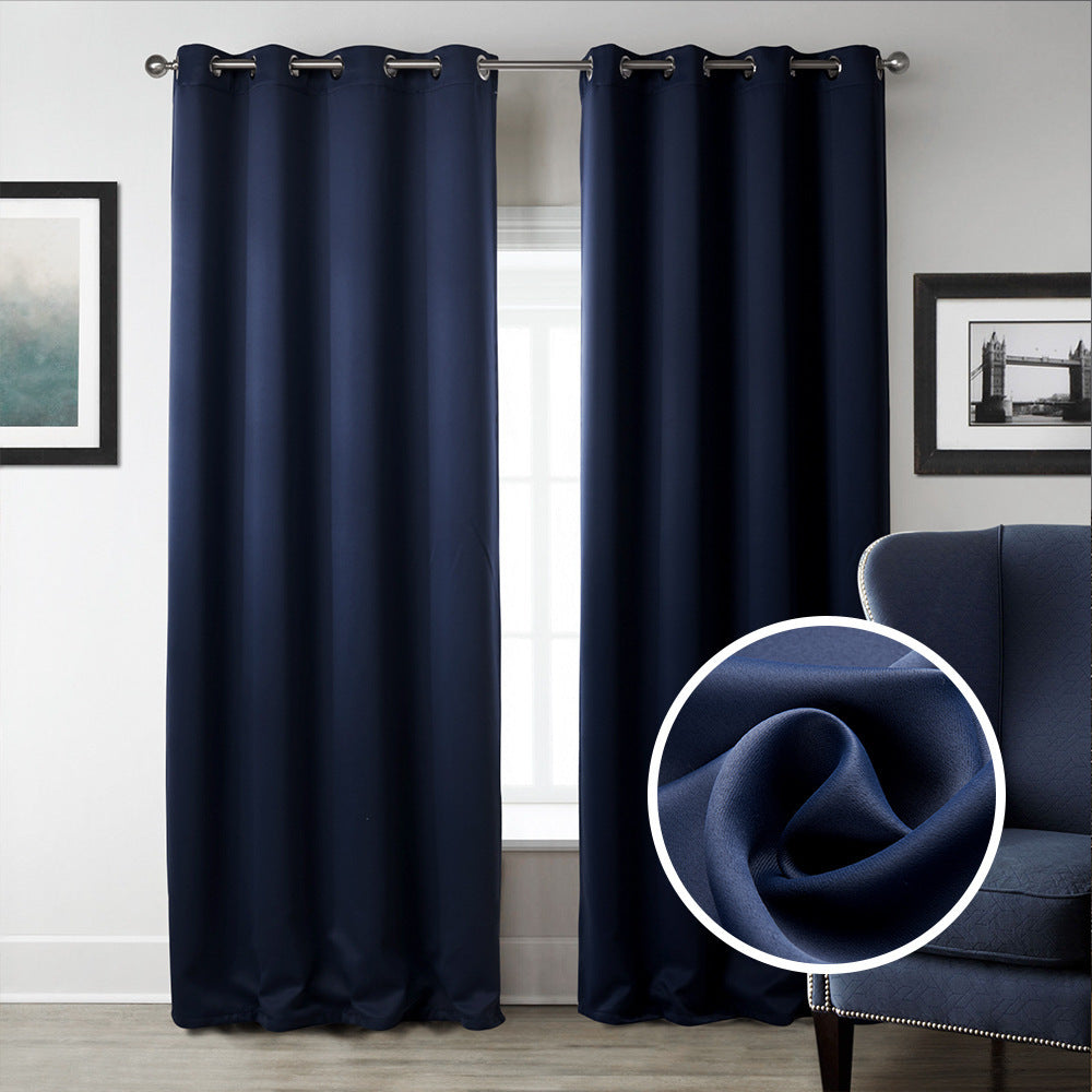 Shopi Vella dark blue blackout curtains hanging in a living room with close-up fabric detail