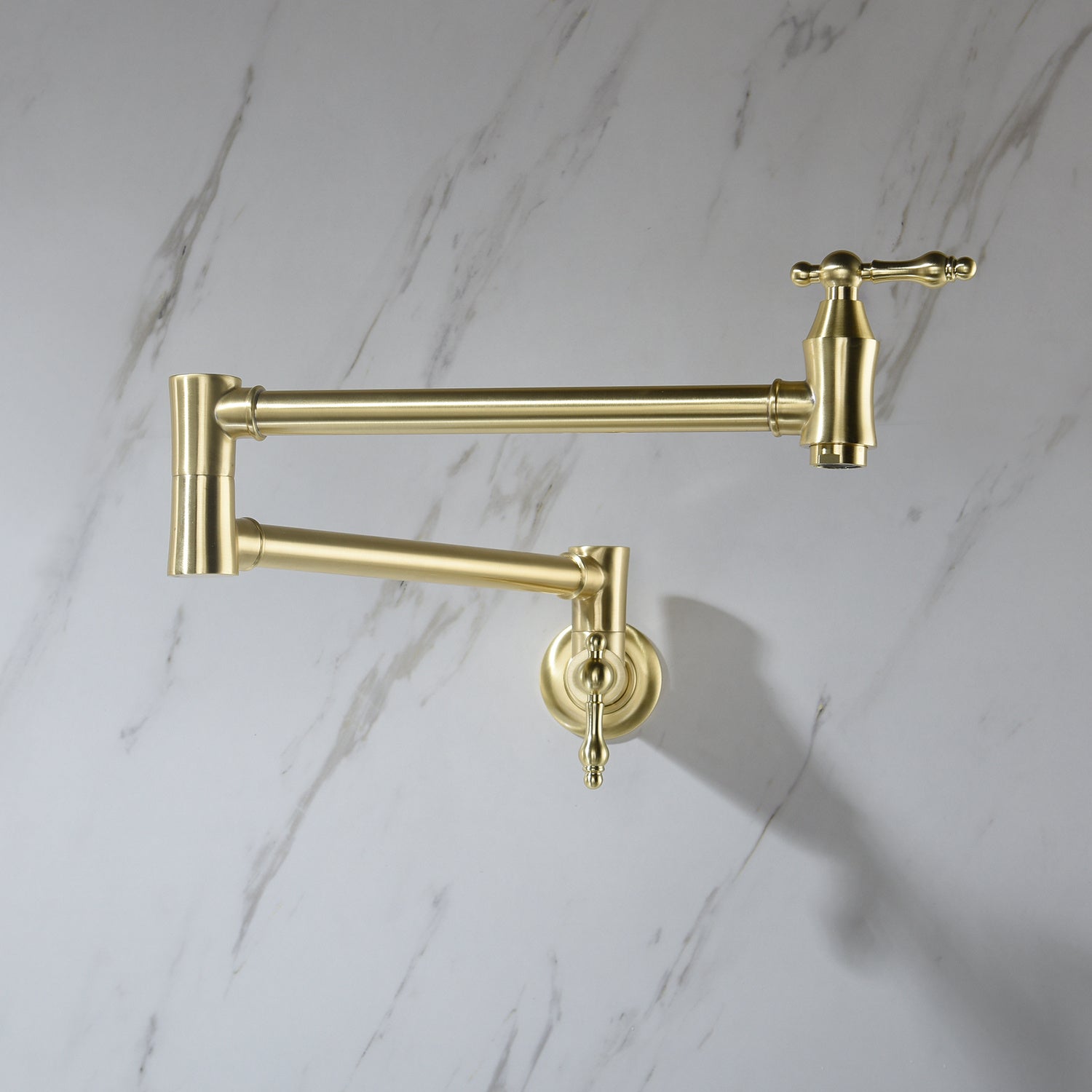 Shopi Vella brass folding kitchen faucet mounted on marble wall for space-saving home storage