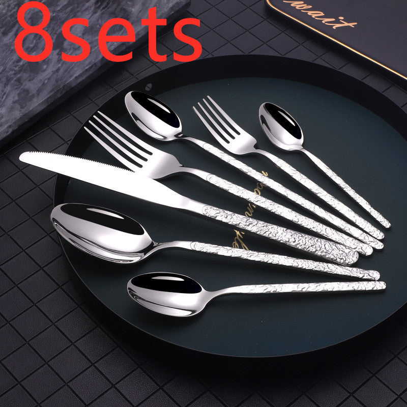 Silver cutlery set on black plate not gold cutlery set for dinner parties by Shopi Vella