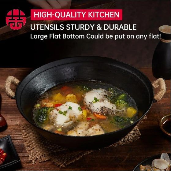 Handmade cast iron wok pan by Shopi Vella with large flat bottom cooking fish and vegetables