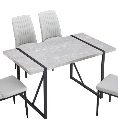 Shopi Vella dining table with gray marble top and black metal legs paired with white modern chairs home office modern furniture