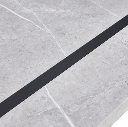 Close-up of Shopi Vella dining table surface showing marble texture and black inlay for home office modern furniture