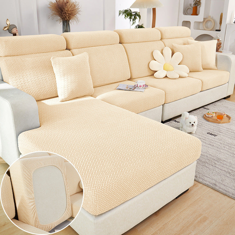 Beige machine washable sofa cushion cover on sectional sofa with decorative pillows in modern living room