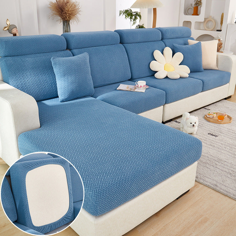Shopi Vella machine washable sofa cushion cover in blue fitted on sectional sofa with decorative pillows