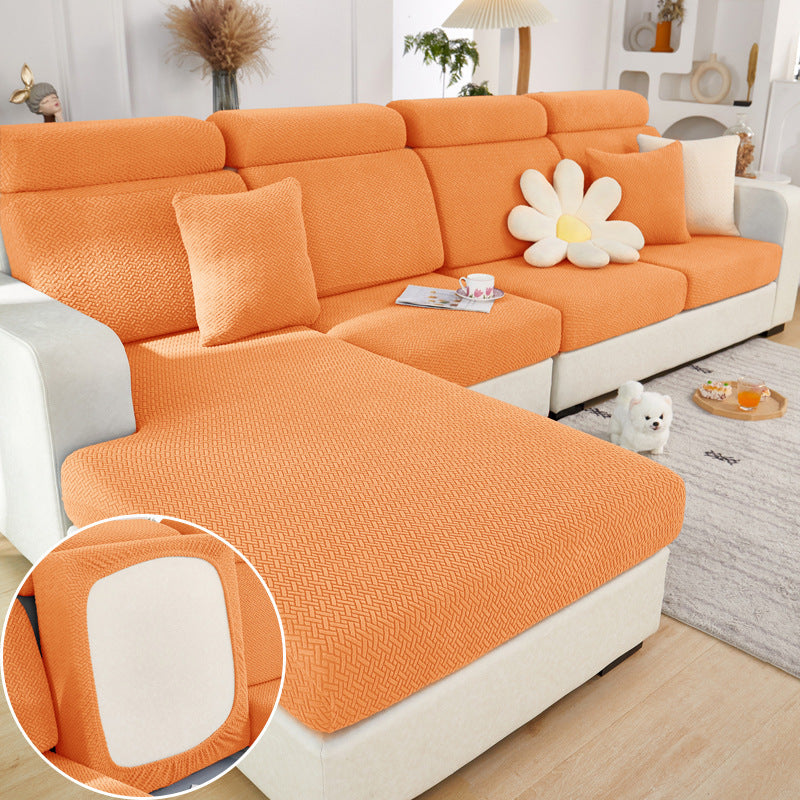 Orange machine washable sofa cushion cover by Shopi Vella on sectional sofa in modern living room