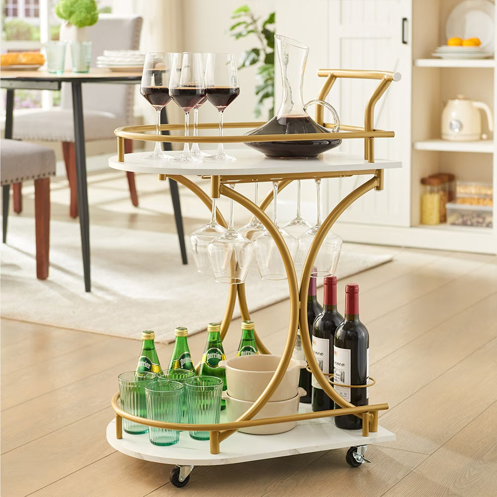 Modern bar trolley for home with gold frame, glass holders, wine bottles, and green glasses on wheels