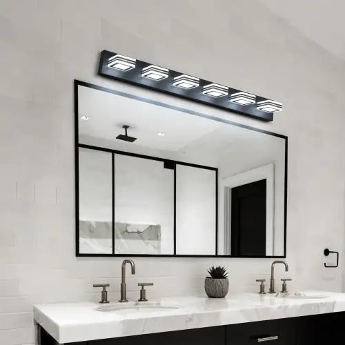 Modern black bathroom vanity light with six square LED lights mounted above a large rectangular mirror