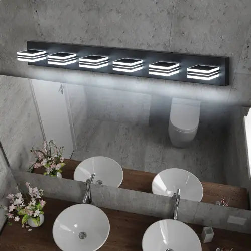 Modern black bathroom vanity light with six square LED fixtures mounted above a double sink mirror