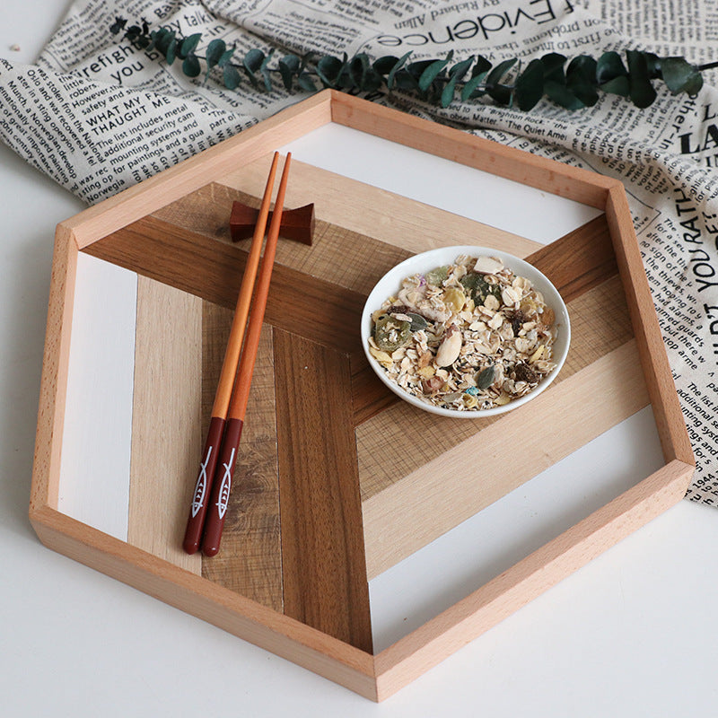 Modern dessert serving tray with geometric wood design holding bowl of granola and wooden chopsticks