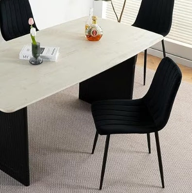 Shopi Vella modern kitchen chair set in black with slim legs around a rectangular dining table