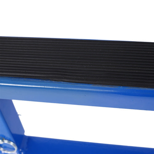 Close-up of blue motorcycle engine stand with wheels showing textured black platform and sturdy frame