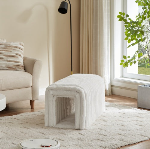 White ottoman storage bench with pet hideaway in cozy living room next to beige sofa and large window
