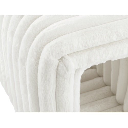 Close-up of white plush fabric on ottoman storage bench with pet hideaway showing soft texture