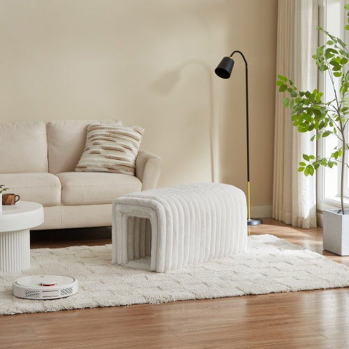 Cream ottoman storage bench with pet hideaway in cozy living room with beige sofa and floor lamp