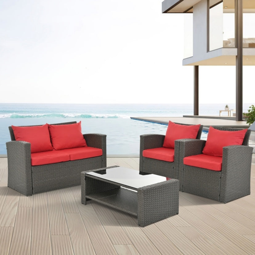 Shopi Vella outdoor patio furniture set with gray wicker frame and red cushions on beachside deck