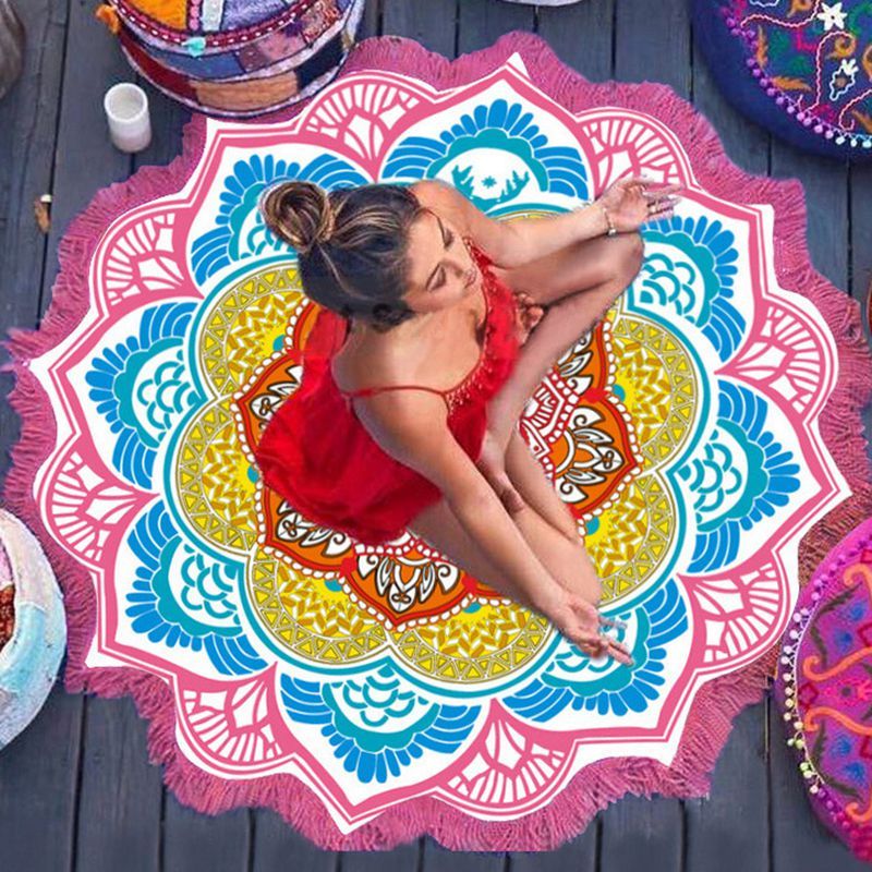 Shopi Vella polygon yoga mat round with colorful floral pattern and fringed edges