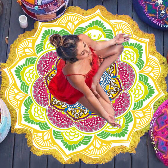 Polygon yoga mat round with colorful floral pattern and yellow fringe, woman meditating on wooden floor