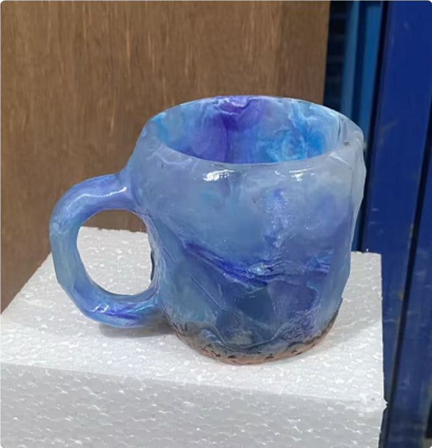 Blue and purple resin crystal coffee mug with textured design for kitchen storage by Shopi Vella