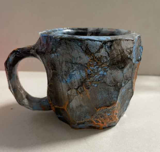 Shopi Vella resin crystal coffee mug with textured gray and orange design for kitchen storage