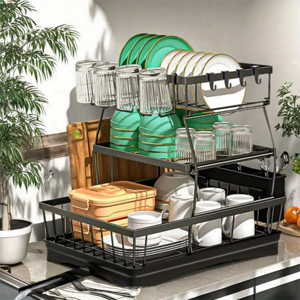 Shopi Vella rust proof kitchen dish drainer holding plates, glasses, and storage jars in black metal frame