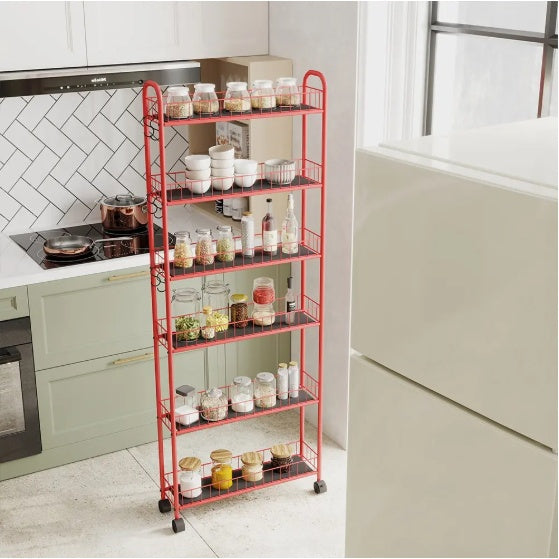 Red slim rolling kitchen storage cart by Shopi Vella with five shelves holding jars and bottles in modern kitchen