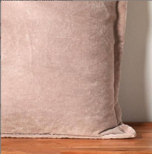 Shopi Vella solid throw pillow with flange in soft beige pillow case on wooden surface