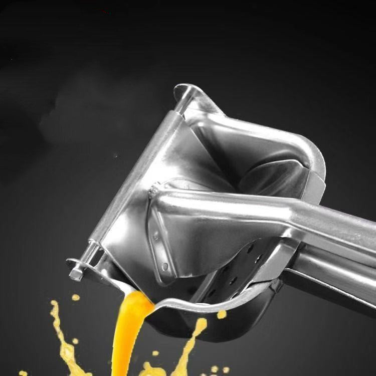 Shopi Vella stainless steel manual juicer squeezing fresh juice on black background