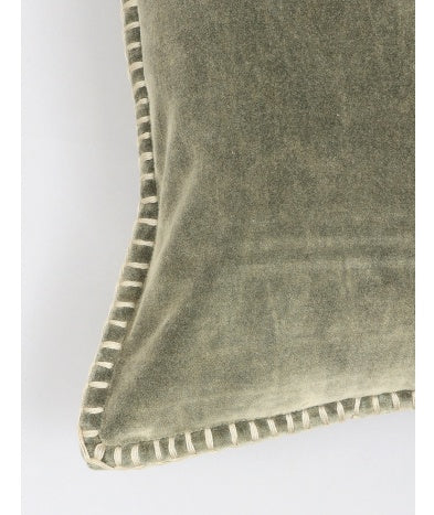 Close-up of Shopi Vella stonewashed velvet throw pillow case with soft textured fabric and stitched edges