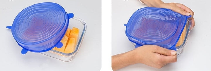 Blue stretch silicone food covers sealing a glass container with orange slices inside
