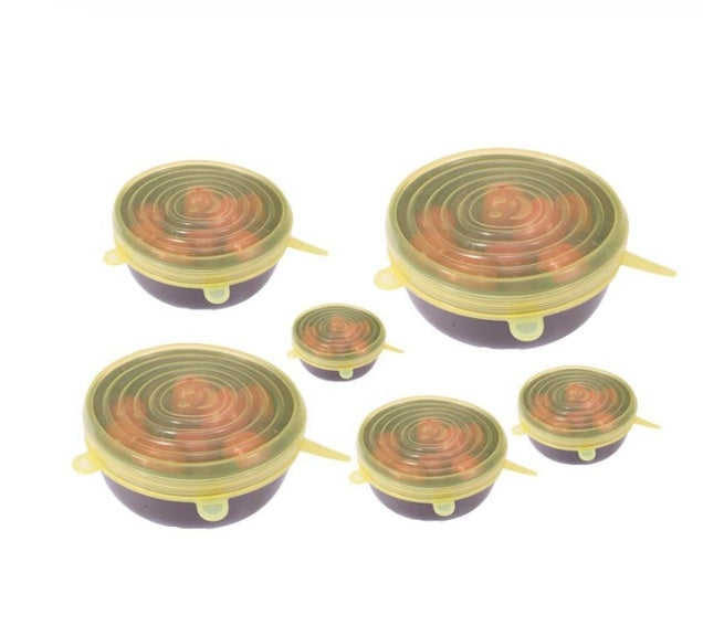 Set of stretch silicone food covers in various sizes covering bowls to keep food fresh