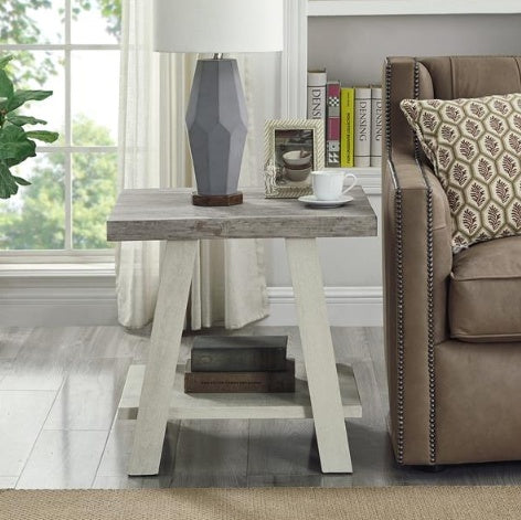 Shopi Vella two tone wooden side table with a lamp, picture frame, and coffee cup next to a brown sofa