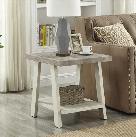 Shopi Vella two tone wooden side table with lower shelf next to leather sofa and decorative lamp