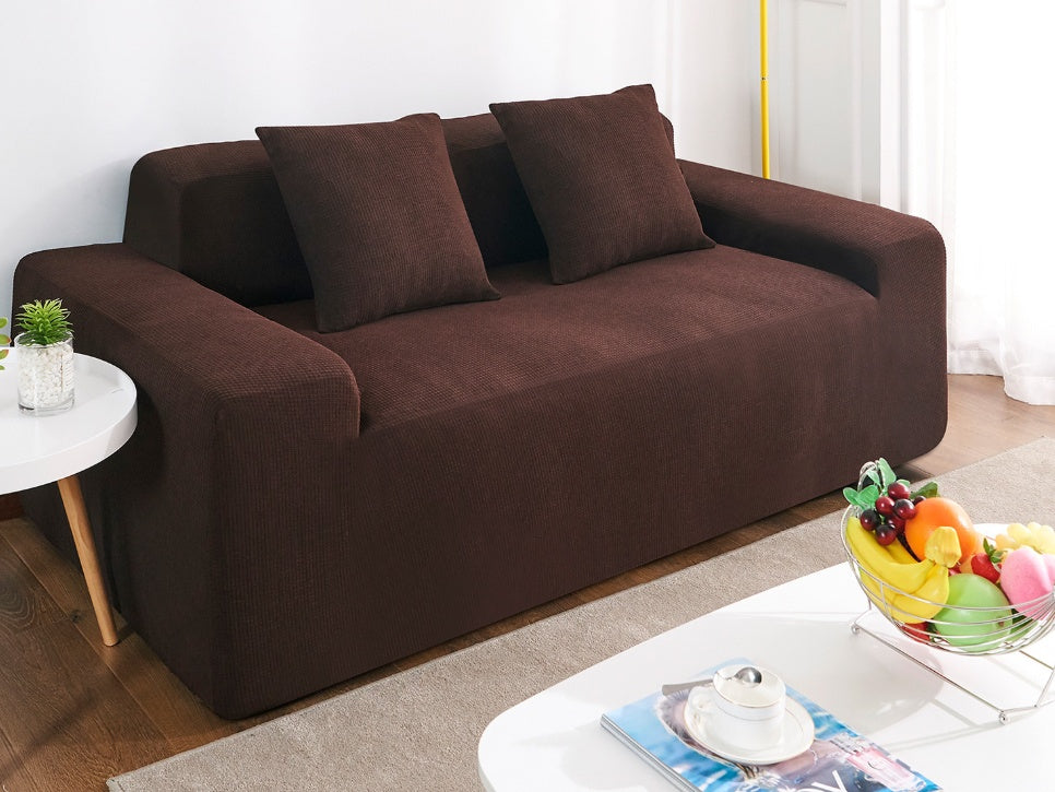 Shopi Vella waterproof sofa slipcover in brown fitted on a modern sofa with matching cushions