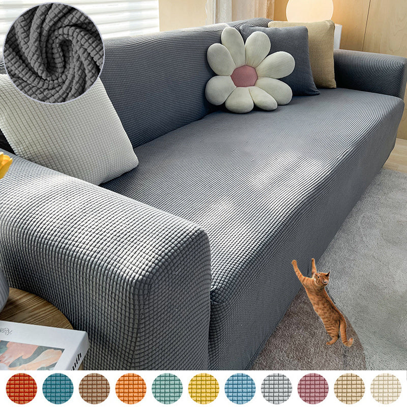 Shopi Vella waterproof sofa slipcover in gray with textured fabric protecting sofa from pet scratches