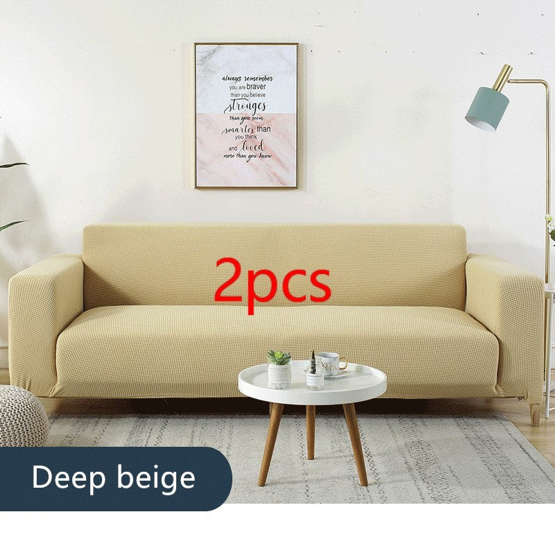 Shopi Vella deep beige waterproof sofa slipcover on a modern sofa in a bright living room