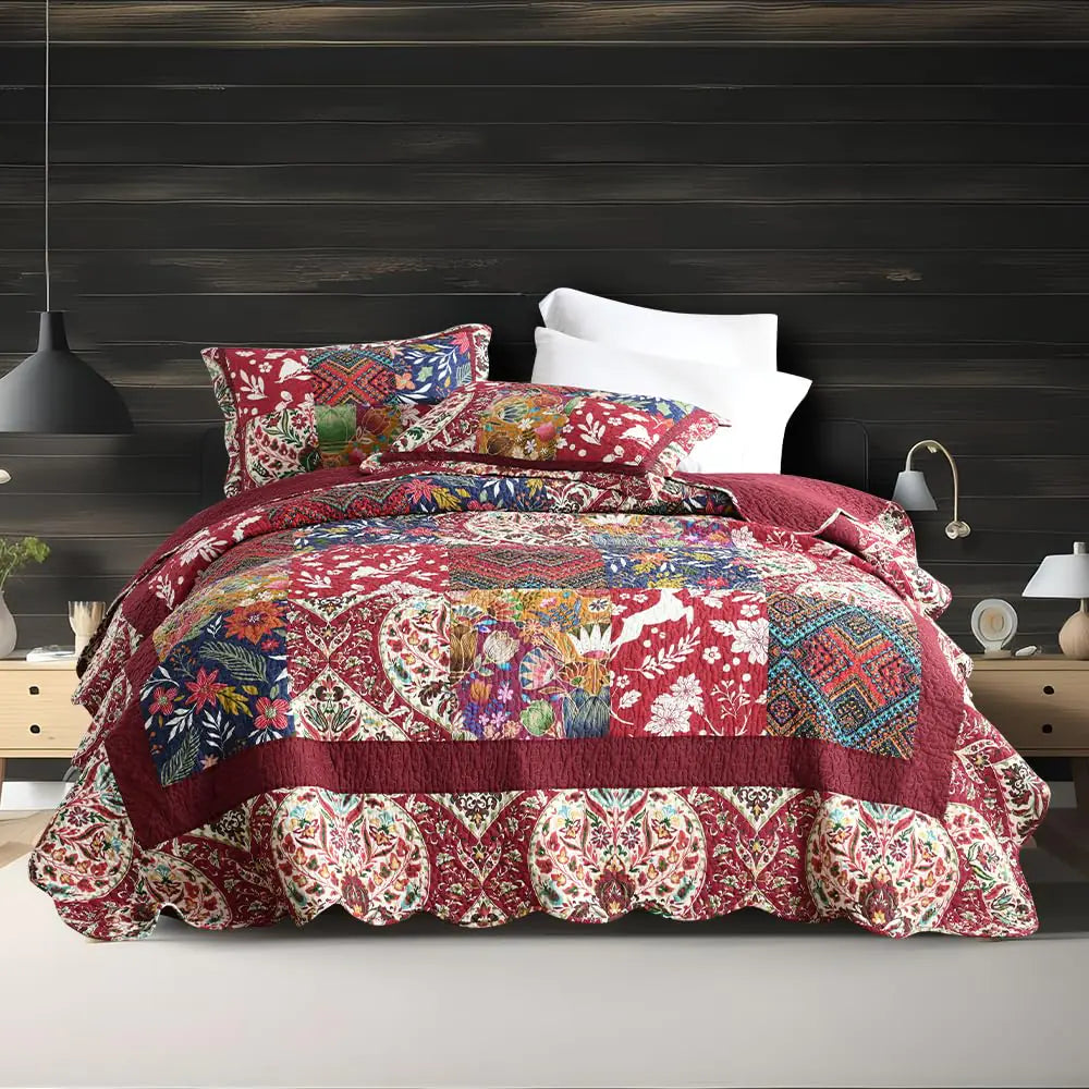 Vintage damask floral bedding set in red with colorful patchwork design on a bed