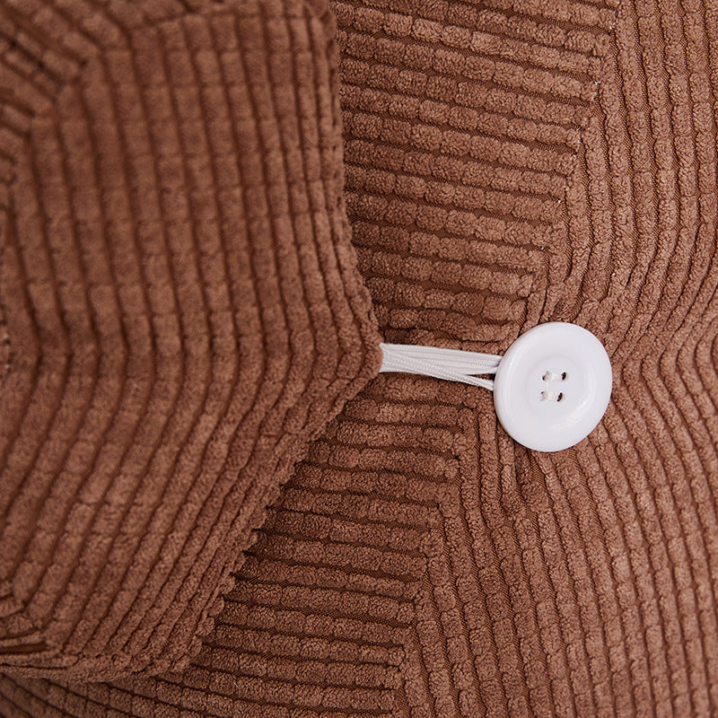 Close-up of brown corduroy pillow case with white button for waist backrest pillow by Shopi Vella