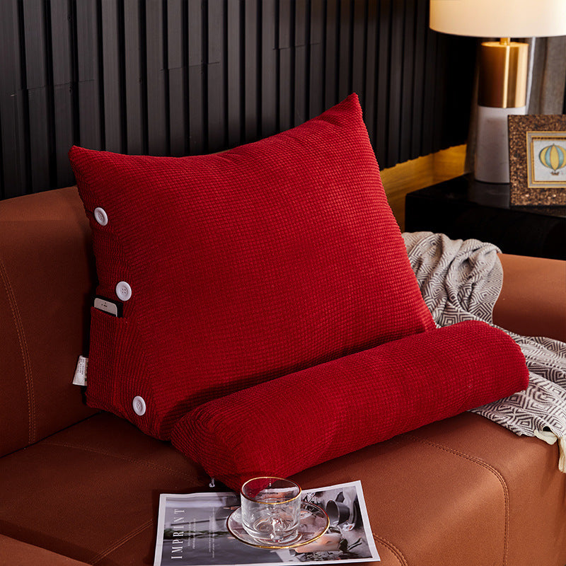 Shopi Vella red waist backrest pillow with textured fabric and button details on brown sofa