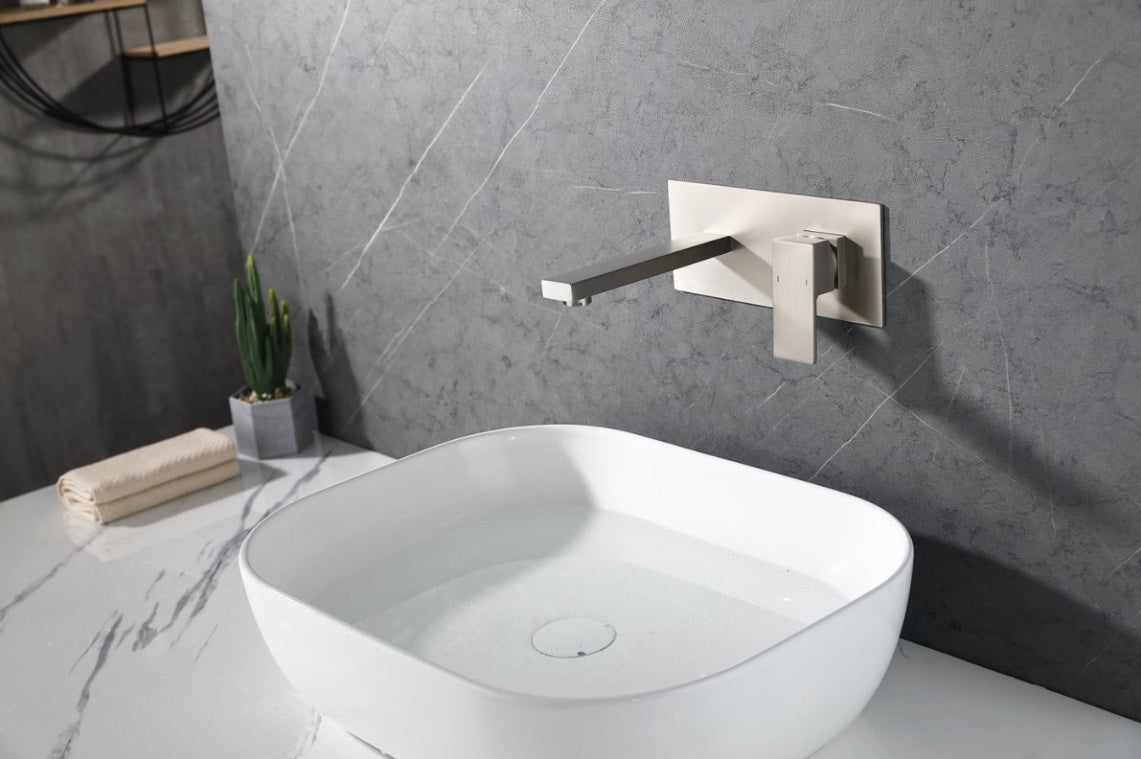 Shopi Vella wall mount bathroom faucet brushed nickel installed above white modern sink on marble countertop