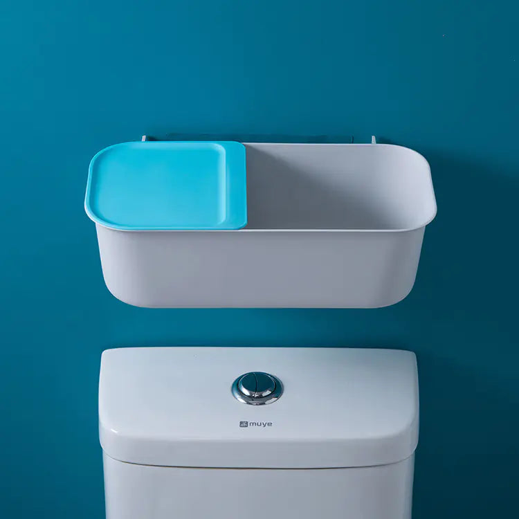 White and blue wall mounted bathroom storage rack installed above toilet for organizing toiletries
