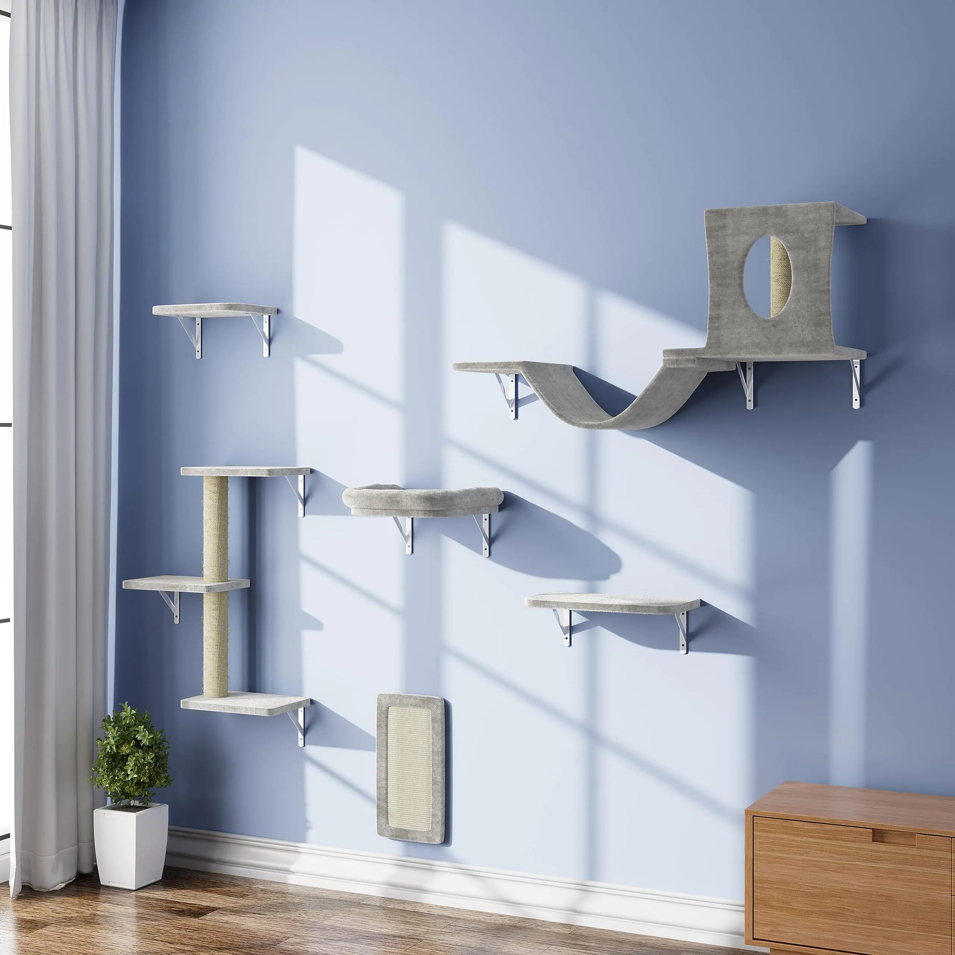 Modern gray wall mounted cat furniture set with platforms, scratching post, and cozy cubby on blue wall
