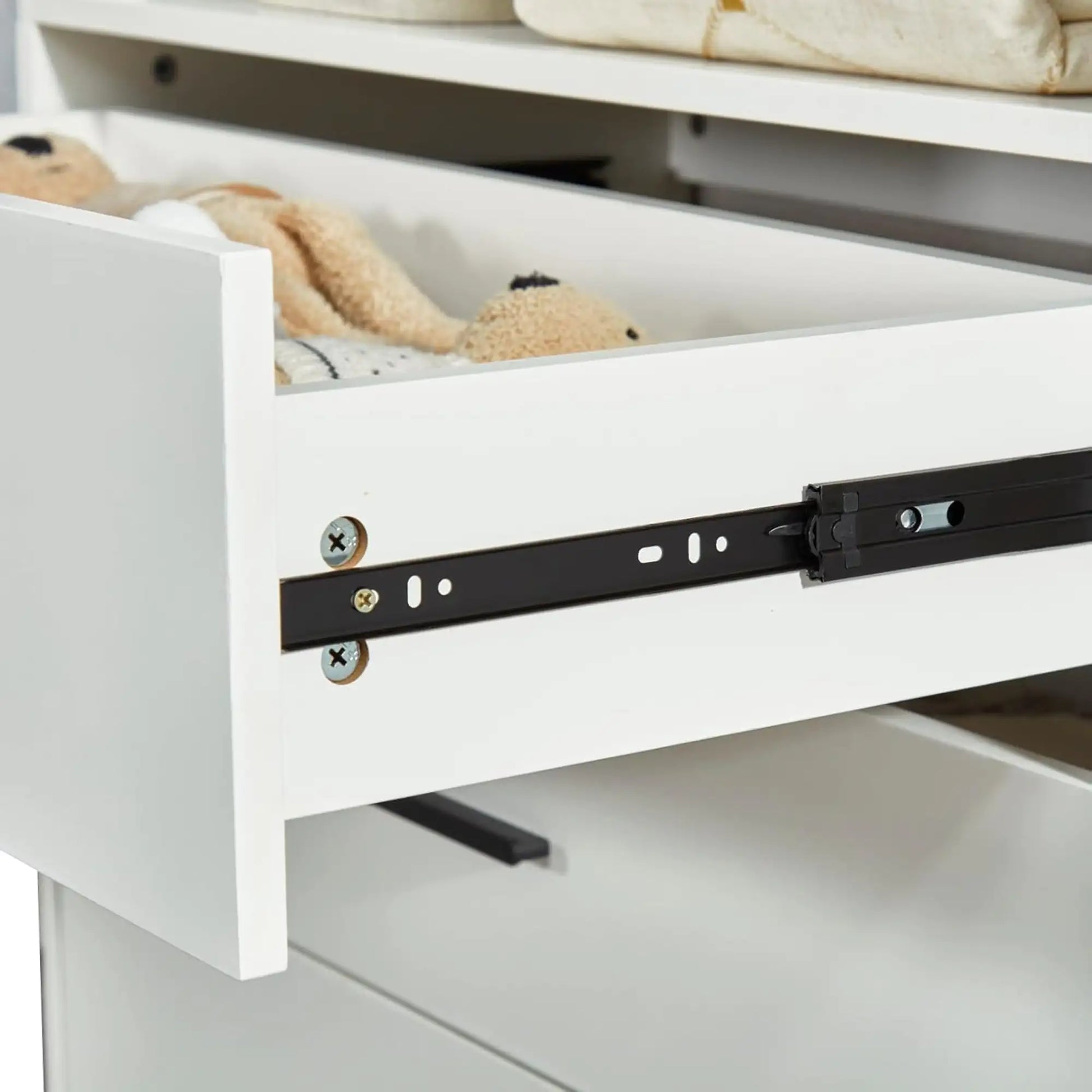 Close-up of white wall mounted closet organizer white drawer with soft-close metal slides