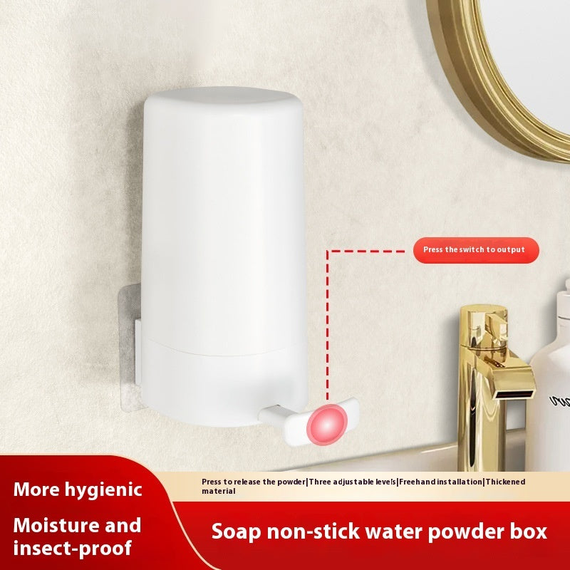 White wall mounted soap grinder dispenser installed on bathroom wall near gold faucet and mirror