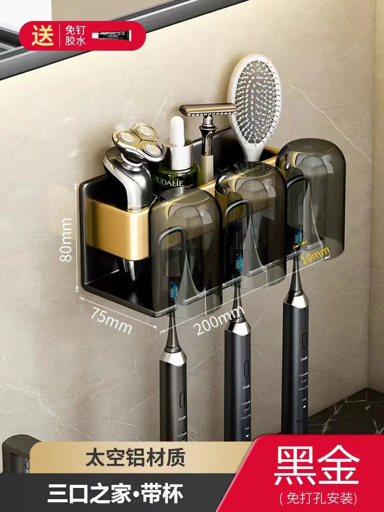 Wall-mounted toothbrush holder with three slots and storage for grooming tools in black and gold