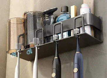 Wall-mounted toothbrush holder with slots for electric toothbrushes and compartments for toiletries